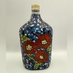 Vintage Mosaic Bottle with Red Flowers and Blue Background